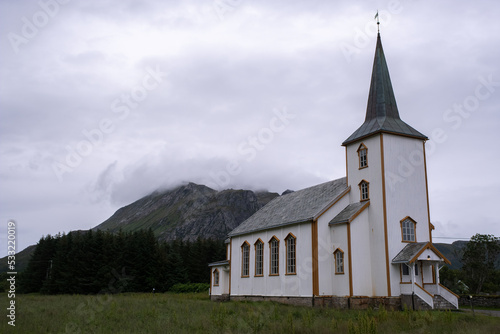 Valberg, Norway - July 18, 2022: Valberg Church is a parish church of the Church of Norway in Vestvagoy Municipality in Nordland county. Cloudy summer day. Selective focus photo