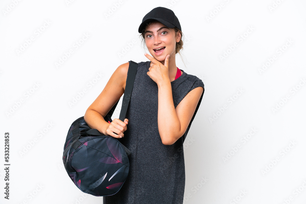 Young sport woman with sport bag isolated on white background smiling Young sport woman with sport bag isolated on white background smiling