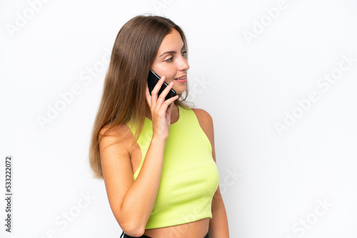 Young caucasian woman isolated on white background keeping a conversation with the mobile phone with someone