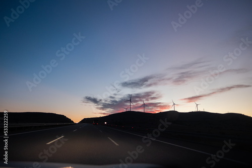 Wind Turbines Across the Hill on a morning sun