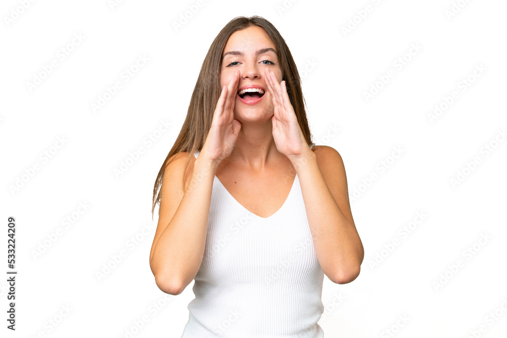 Young pretty woman over isolated background shouting and announcing something Young pretty woman over isolated background shouting and announcing something