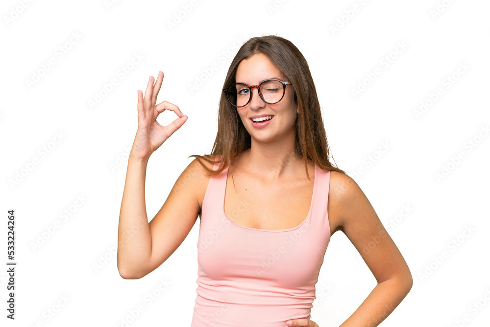 Young pretty woman over isolated background showing ok sign with fingers Young pretty woman over isolated background showing ok sign with fingers