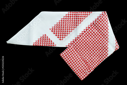 saudi men clothing accessory head scarf red shemagh closeup black background space for text luxury