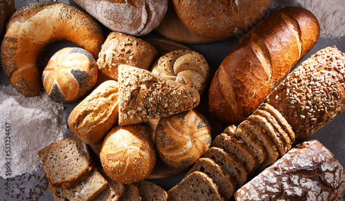 Assorted bakery products including loafs of bread and rolls