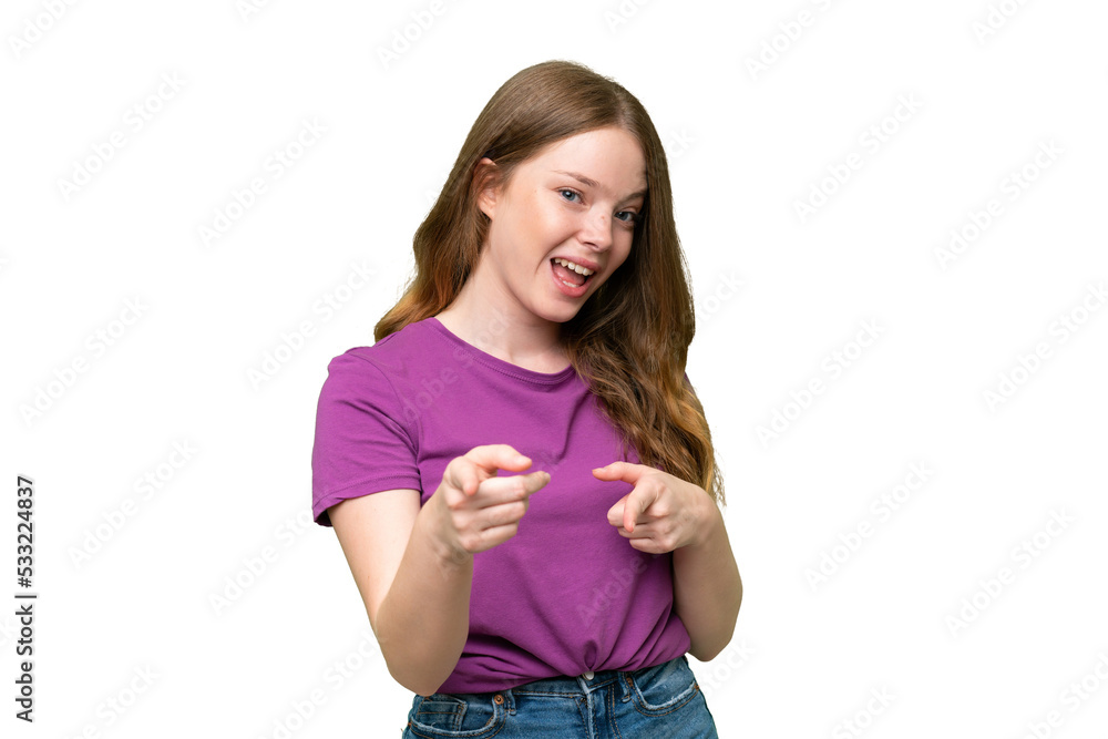 Young pretty woman over isolated background surprised and pointing front Young pretty woman over isolated background surprised and pointing front