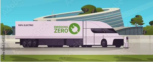 electric semi trcuk trailer charging parking at the charger station with a plug in cable electrified transportation e-motion