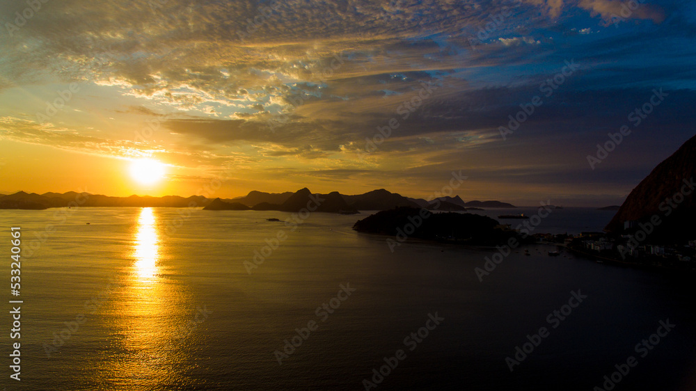 Aerial view of Guanabara Bay at dawn, one of Rio de Janeiro's postcards. In the background the mountains of the state. Aerial view of Guanabara Bay at dawn, one of Rio de Janeiro's postcards. In the background the mountains of the state.