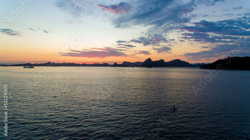 Aerial view of Guanabara Bay at dawn  one of Rio de Janeiro s postcards. In the background the mountains of the state.