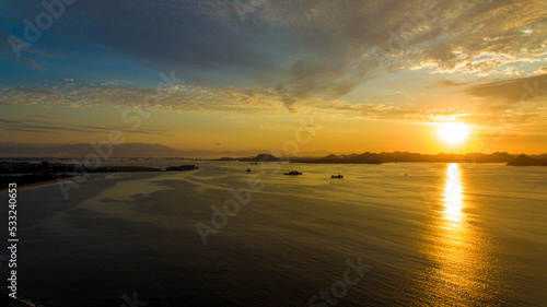 Aerial view of Guanabara Bay at dawn, one of Rio de Janeiro's postcards. In the background the mountains of the state.