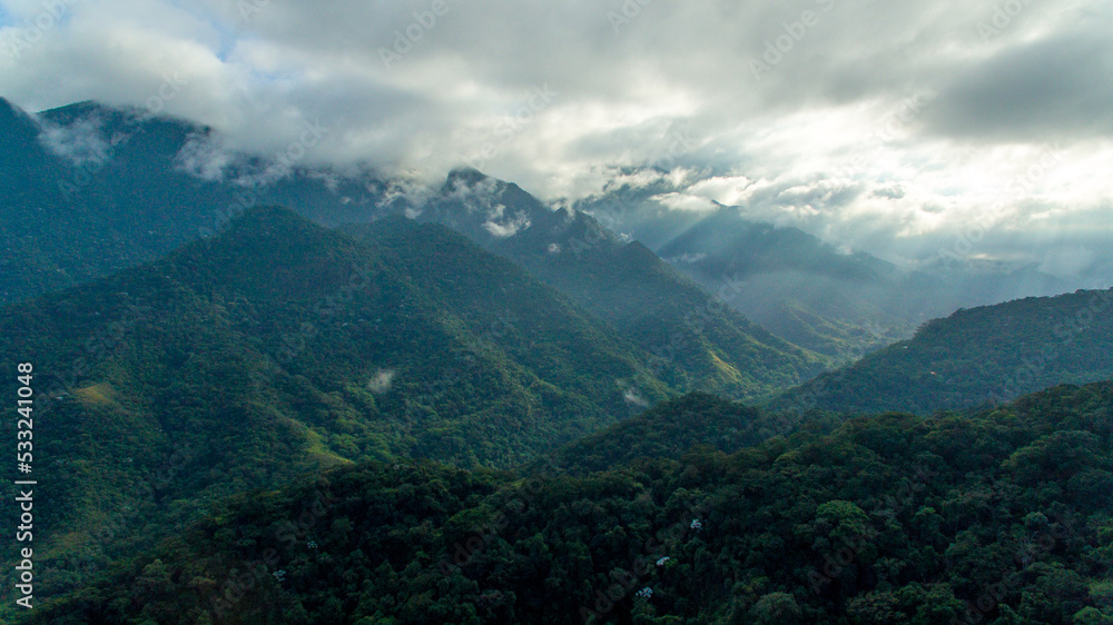 Sunrise on the exuberant mountains of the Atlantic Forest within the protected area of Três Picos State Park, in Cachoeira de Macacu, Rio de Janeiro