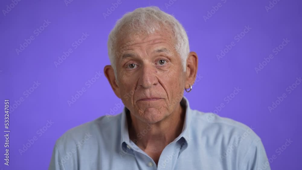 Slow motion closeup portrait of excited jubilant overjoyed elderly man 70s doing winner gesture celebrate clenching fists say yes isolated on solid purple background studio Slow motion closeup portrait of excited jubilant overjoyed elderly man 70s doing winner gesture celebrate clenching fists say yes isolated on solid purple background studio