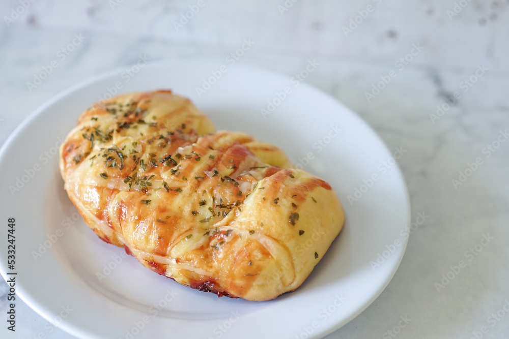 Sausage buns bread. Soft baked bun (dough) stuffed with sausage for fast food breakfast or coffee break. Sausage roll, (hot dog). With mayo, tomato sauce, mozarella cheese and parsley topping Sausage buns bread. Soft baked bun (dough) stuffed with sausage for fast food breakfast or coffee break. Sausage roll, (hot dog). With mayo, tomato sauce, mozarella cheese and parsley topping