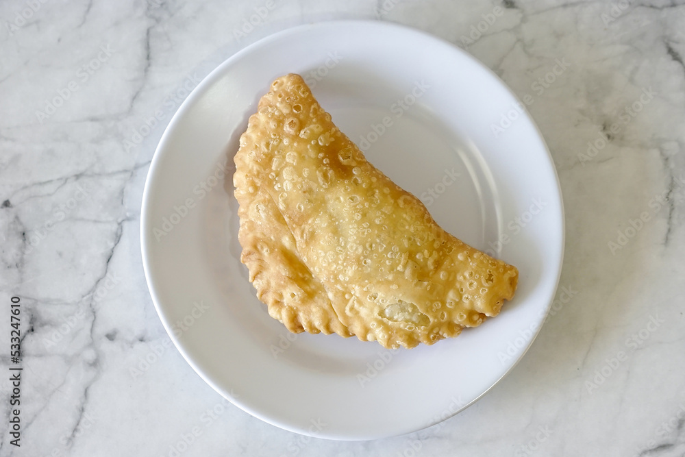Cornish pasty filled with chicken and potato. Pastry minced pie or Pastel asian style cuisine. Homemade flaky pasty with mince meat filling
Cornish pasty filled with chicken and potato. Pastry minced pie or Pastel asian style cuisine. Homemade flaky pasty with mince meat filling