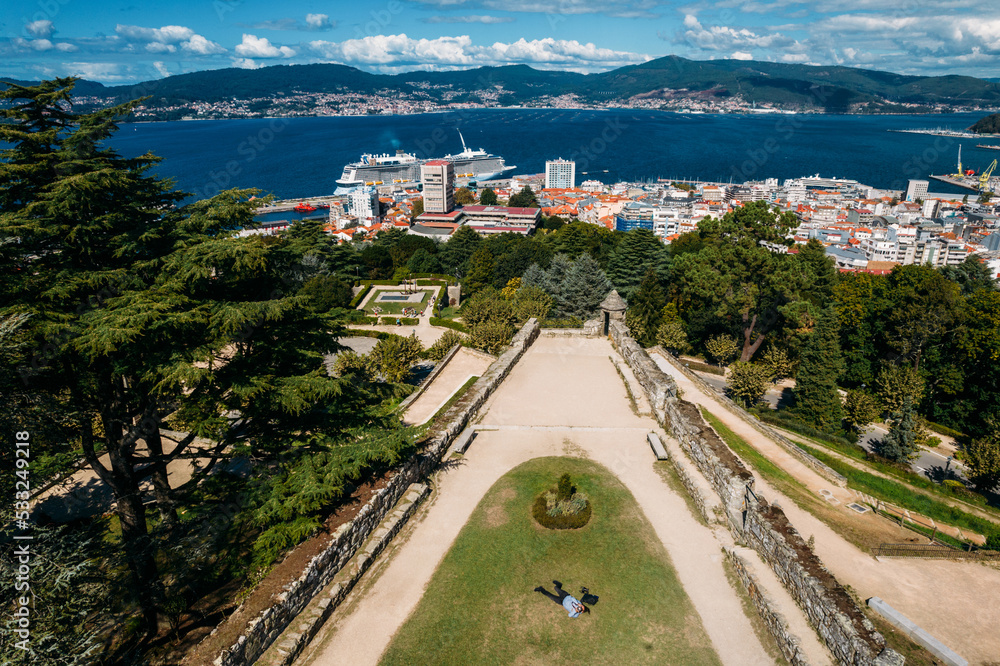 Drone aerial top down view of tourists at Monte do Castro park in Vigo, Spain