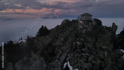 Aerial drone view of Mount Pilchuck fire lookout tower at the top of Cascade Mountains, Washington photo