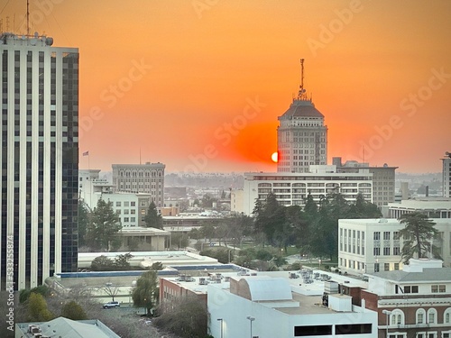 Sunset behind building photo