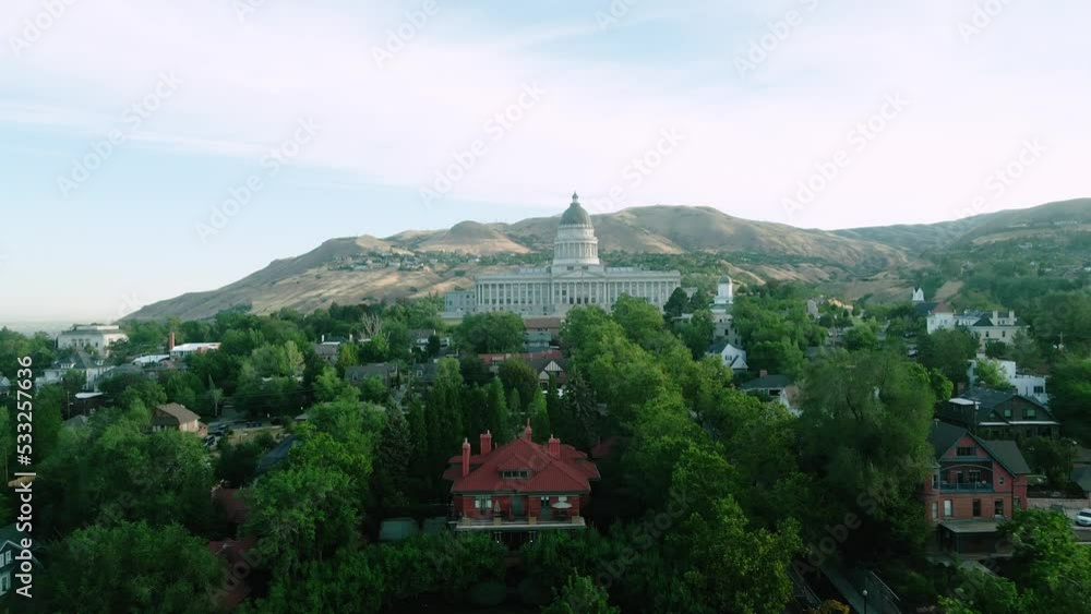 cinematic slow push in of Utah State Capitol Building in Salt Lake City above trees and houses at 5am in the morning cinematic slow push in of Utah State Capitol Building in Salt Lake City above trees and houses at 5am in the morning