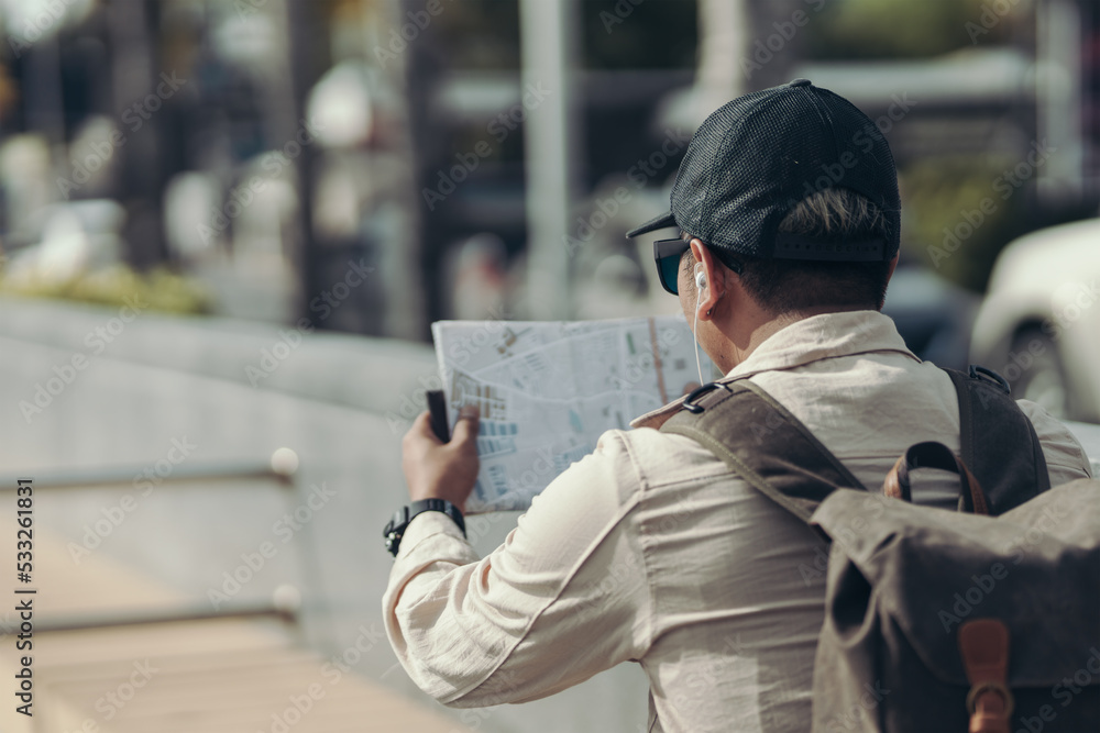 Tourists hold maps to find attractions, restaurants or hotels. backpacker and travel concept. Tourists hold maps to find attractions, restaurants or hotels. backpacker and travel concept.