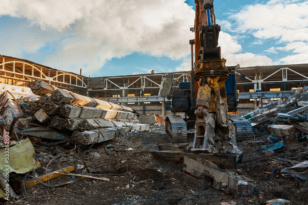 Excavator destroyer removes debris winter day Excavator destroyer removes debris winter day