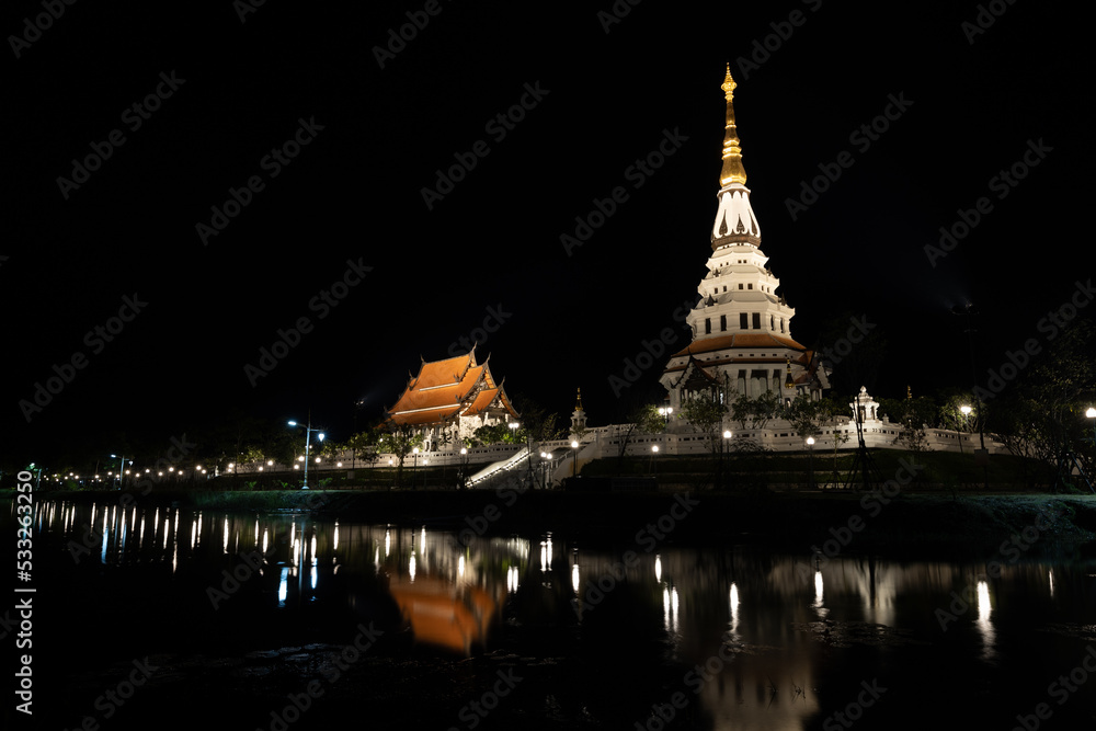 Naklejka premium illustration, book cover, image of a temple pagoda at night, decorated with lights, dark sky