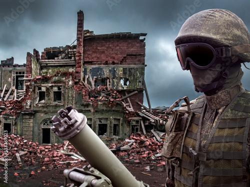 Soldier next to mortar. War...