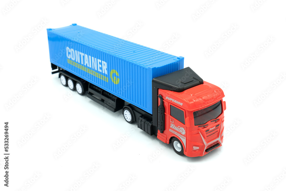 Toy truck on white background. Logistics and wholesale concept Toy truck on white background. Logistics and wholesale concept