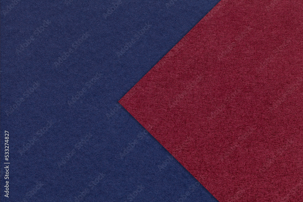 Texture of navy blue paper background, half two colors with dark red arrow, macro. Craft wine cardboard. Texture of navy blue paper background, half two colors with dark red arrow, macro. Craft wine cardboard.