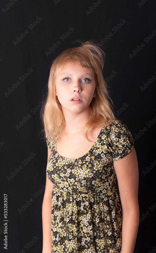 girl in a dress on a black background