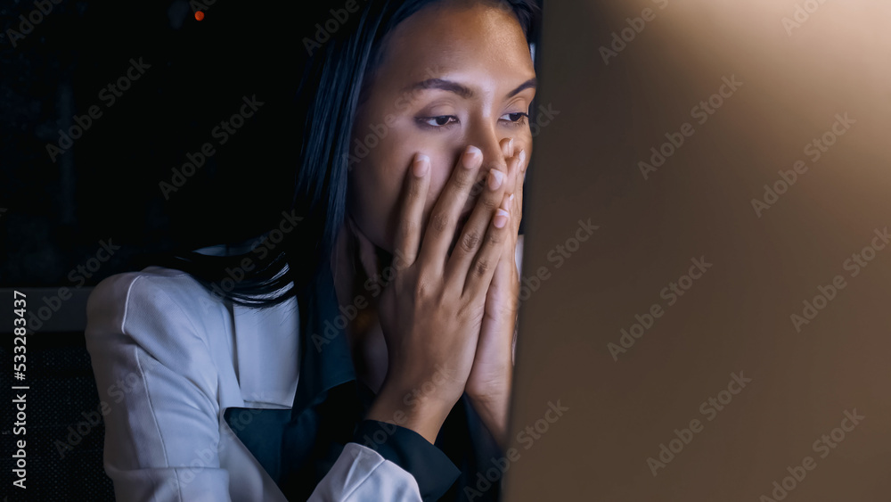 Stressed young Asian businesswoman working overtime at the office. Stressed young Asian businesswoman working overtime at the office.