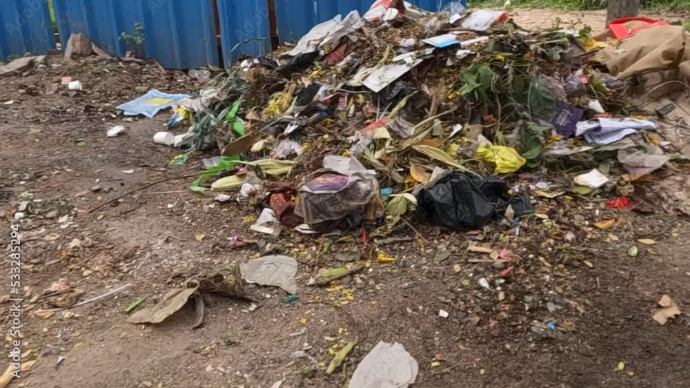 Heap of rubbish or waste material along the road Heap of rubbish or waste material along the road
