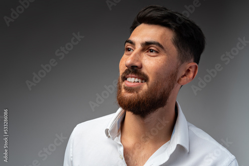 Portrait of handsome confident business on gray background © fotofabrika