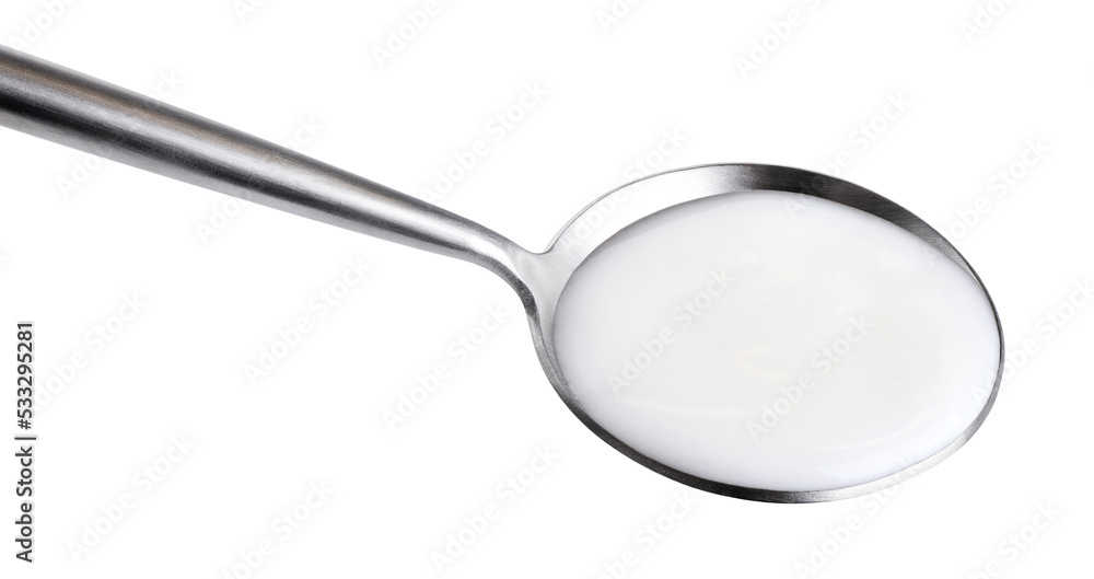 Spoon with yogurt isolated on white background. With clipping path. Spoon with yogurt isolated on white background. With clipping path.