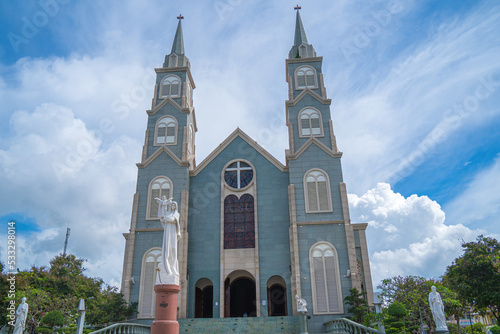 Top view of the Chanh Toa Church in Ba Ria Vung Tau. The light shines on the statue of the Virgin Mary. photo