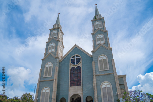 Top view of the Chanh Toa Church in Ba Ria Vung Tau. The light shines on the statue of the Virgin Mary. photo