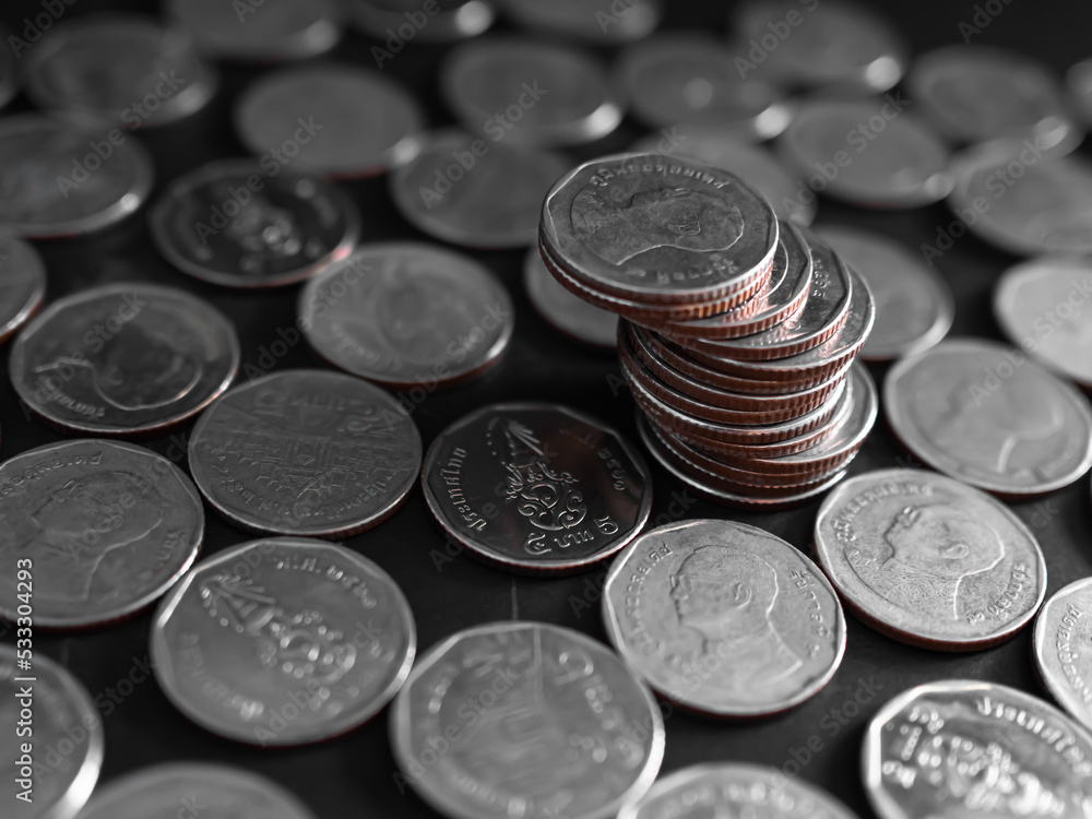 Stack Coin Closeup on Black background.Bank Currency Thai. Plan Income Investment Growth Cash and Saving for 2023 New Year,for Salary,Rate,Stock Market,Credit,Loan,Business or Treasury Finance concept Stack Coin Closeup on Black background.Bank Currency Thai. Plan Income Investment Growth Cash and Saving for 2023 New Year,for Salary,Rate,Stock Market,Credit,Loan,Business or Treasury Finance concept