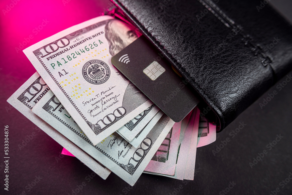 top view of wallet with money and credit cards isolated on plain background. top view of wallet with money and credit cards isolated on plain background.