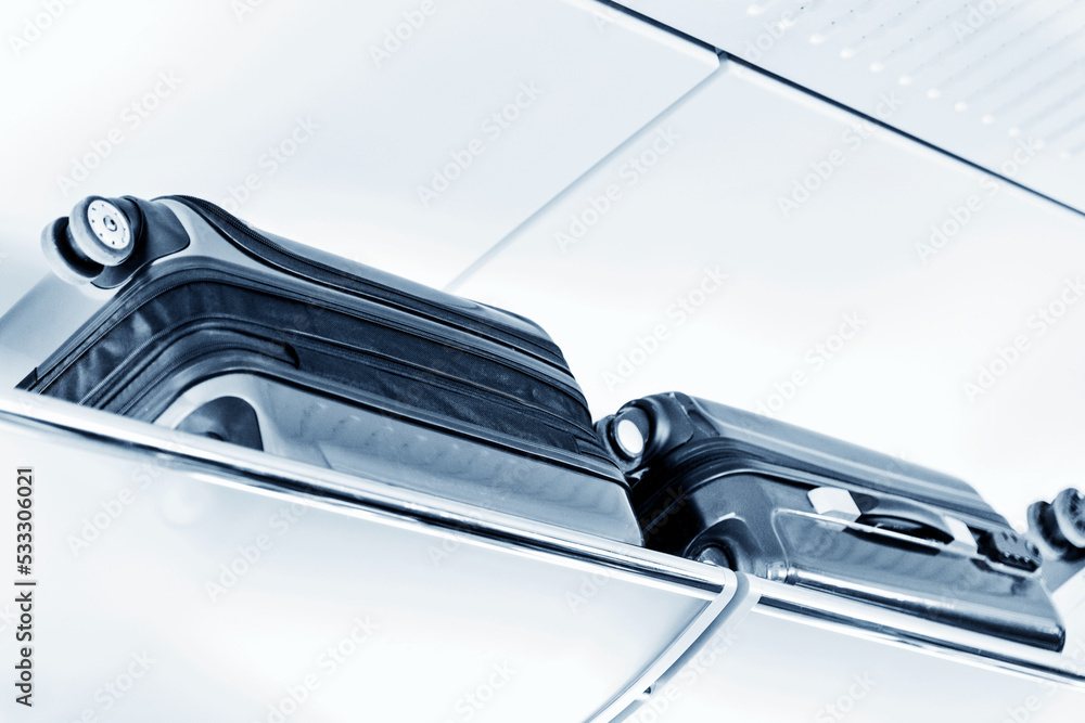 Luggage on shelf in modern train interior Luggage on shelf in modern train interior