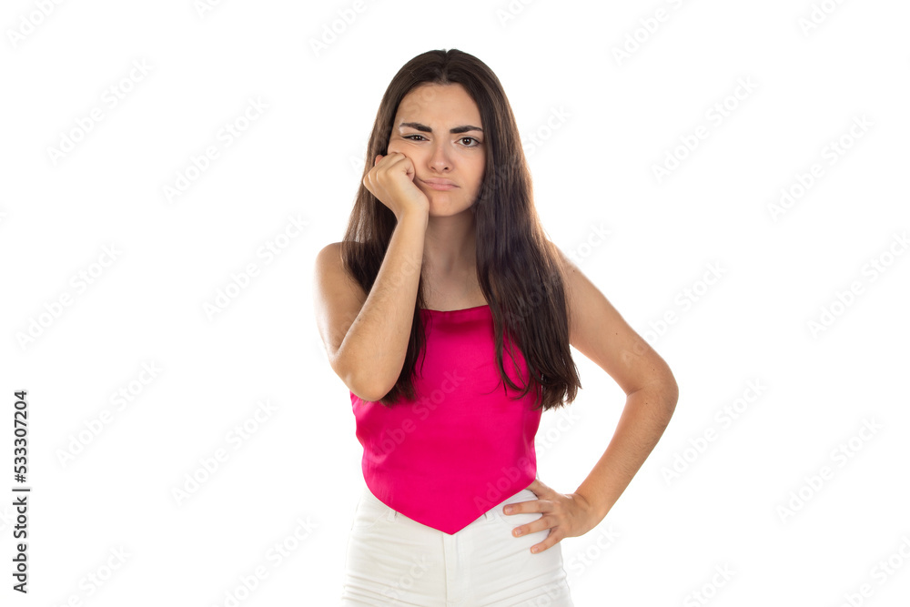 Pensive worried brunette young woman wearing a pink top Pensive worried brunette young woman wearing a pink top