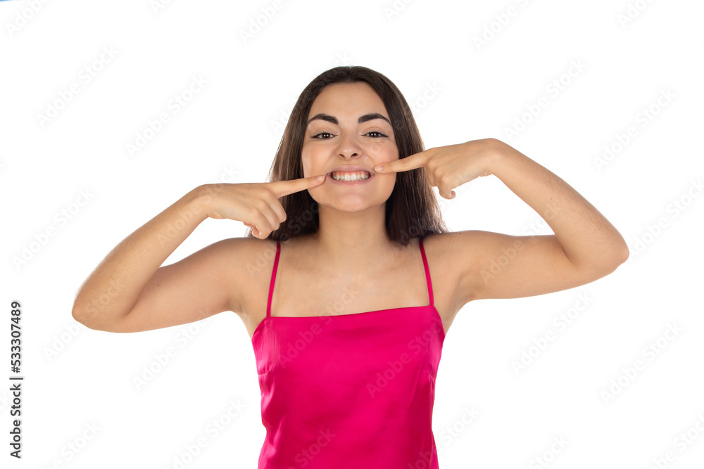 Young brunette woman pointing fingers at mouth Young brunette woman pointing fingers at mouth