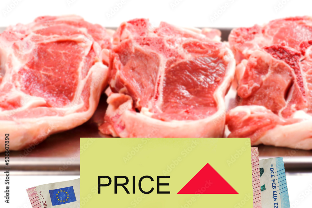 European money and yellow sticker with sign price and red triangle up in focus, Fresh lamb chops in the background. Price increase due to inflation on basic food for consumers concept. Economy crisis.