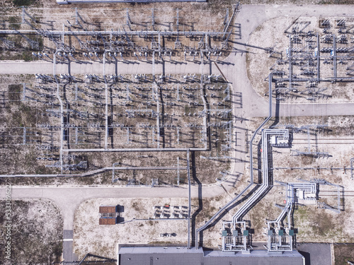 Aerial top down view of a high voltage electrical substation.