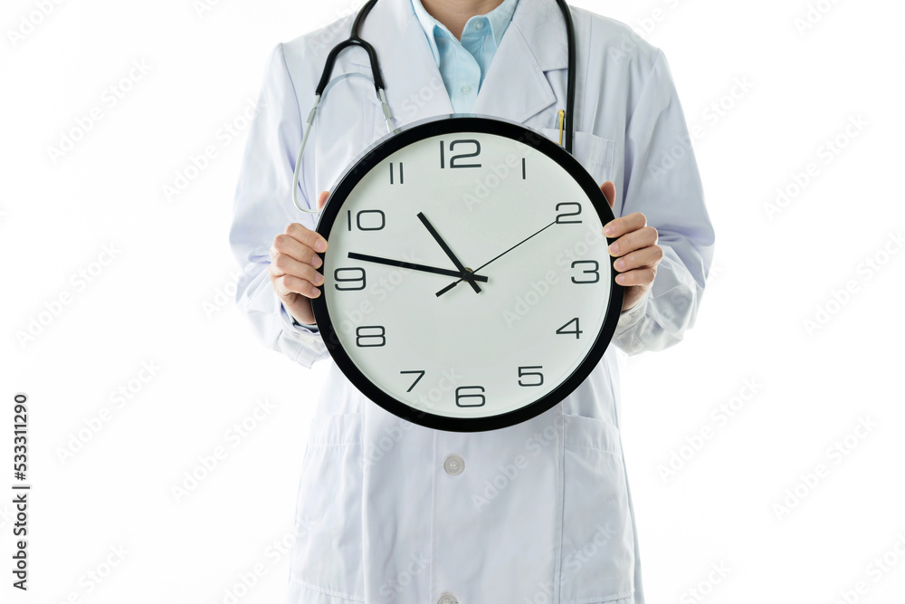 Doctor holding wall clock against white background Doctor holding wall clock against white background