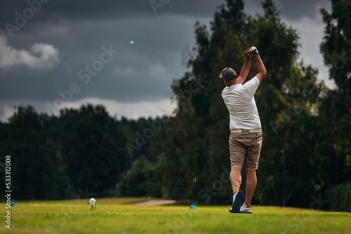 Man hitting the golf ball 