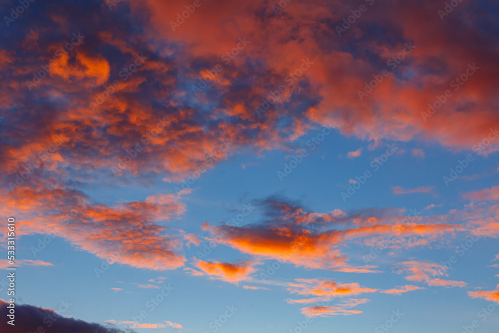 Sunset view with dark and bright red clouds