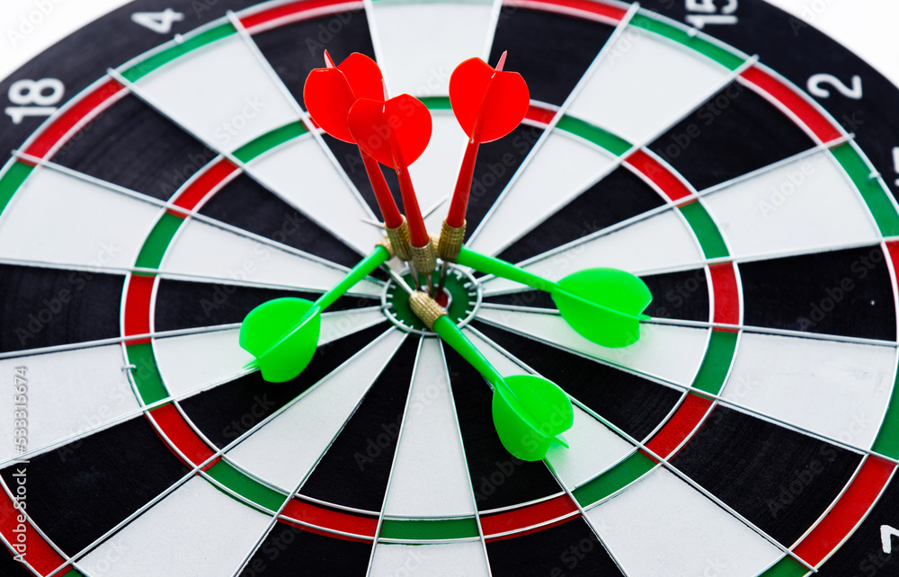 Red dart arrow hitting in the center of the dartboard Red dart arrow hitting in the center of the dartboard