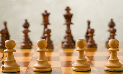 Chess pieces on a chessboard - Focus on the pawns