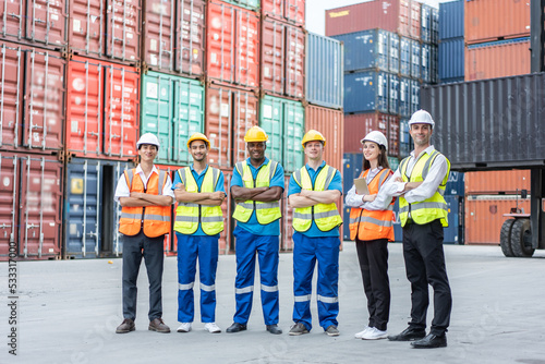 Portrait group of attractive worker people work in container terminal. 