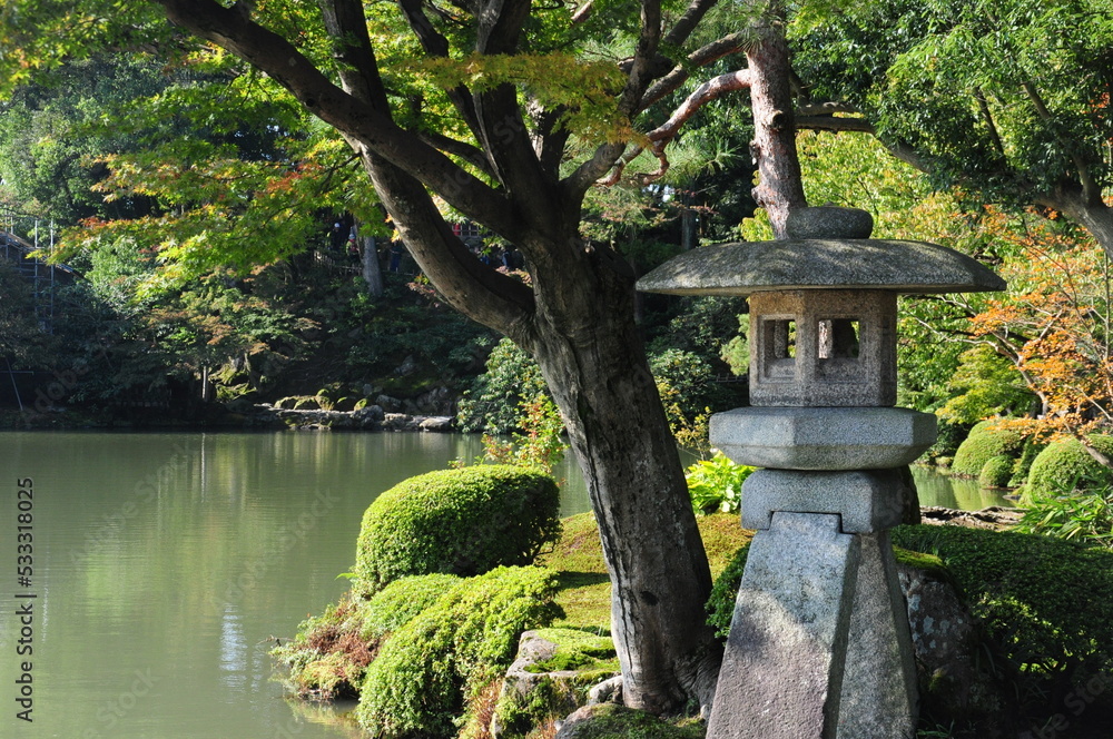 Japanese garden in spring, surrounded by water, Japan Japanese garden in spring, surrounded by water, Japan