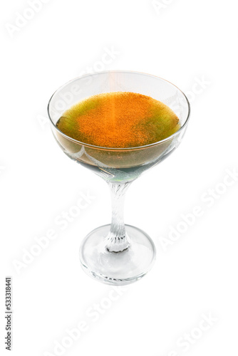 Cocktail with paprika in dessert glass isolated object shot against white background