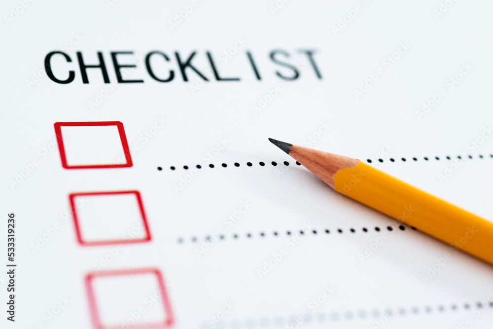 Checklist box on paper with checkmark and pencil Checklist box on paper with checkmark and pencil